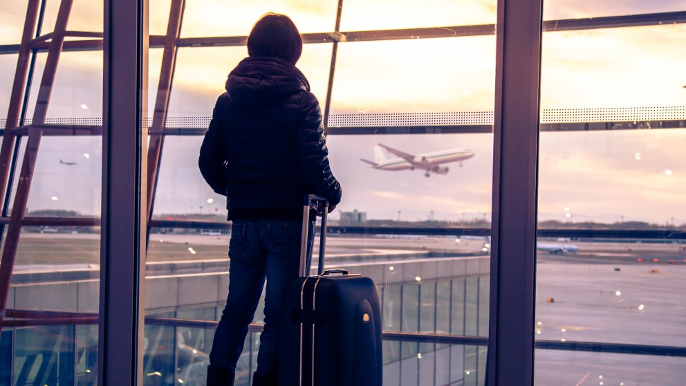 Traveler silhouettes at airport,Beijing Traveller silhouette at airport